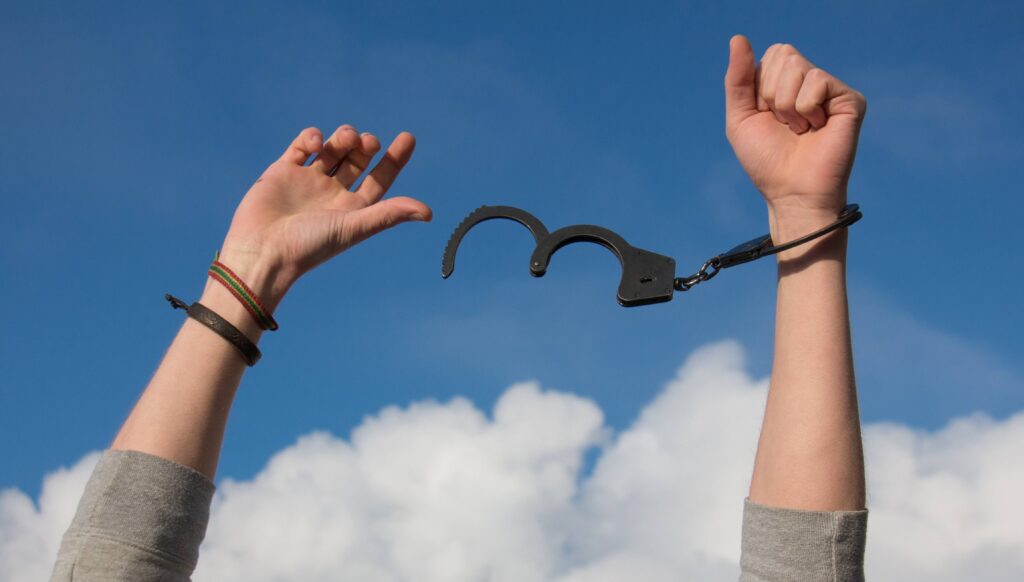 man's hands with handcuffs